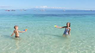 Children playing on the beach 4K