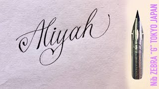 With a sharp pen, ZEBRA G, I write the feminine name Aliyah in calligraphic handwriting.