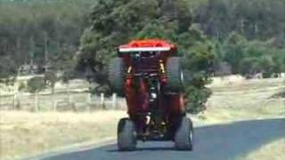 Jeep Wheelstanding on road.