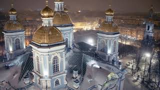 Snowy winter night and st. Nicholas Naval cathedral at Saint Petersburg. Aerial drone footage.