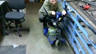 Checking Mobility Scooter access in the workshop