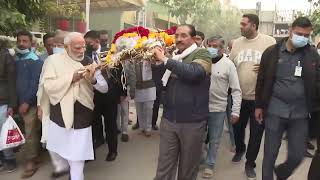 PM Modi carries the mortal remains of his late mother Heeraben Modi in Ahmedabad, Gujarat