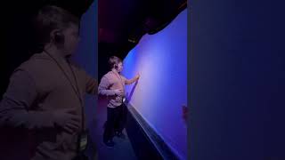 Touching an iceberg at the Titanic Exhibit in NYC