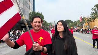 Yee Family Members marching in LAGDP with Flag