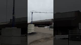 the crane disassembles an old warehouse