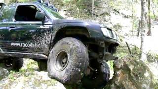 Nissan Frontier crawling over some rocks in Ocala