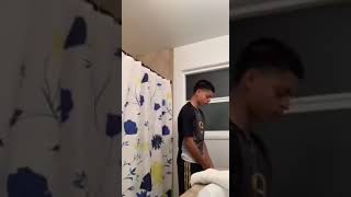 guy punches curtain in bathroom