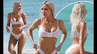 Kim Kardashian Sizzles In Tiny White Bikini Bottoms & Sheer Crop Top On The Beach