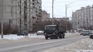 An onboard KamAZ 5320 is driving along a snow-covered street in the capital.