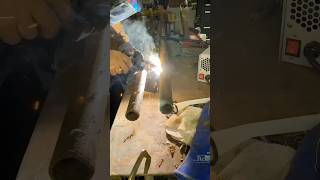 Welding a shelf to hold trailer hitches.