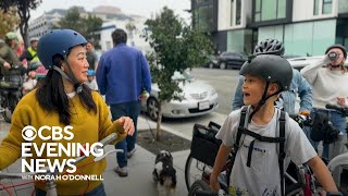 Students and parents swap the bus for biking to school together