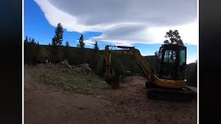 Foundation excavation and breaking rock in the Rockies