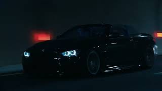 A DARK OWL BMW  IN THE STREET