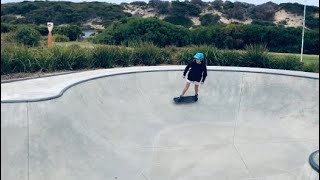 Riding Aireys Inlet skatepark on scooter and skateboard