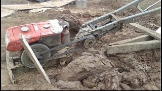 Kubota 4 wheel drive tractor Go into mud and got rescued by Excavator