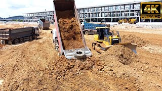 Best action Bulldozer SHANTUI DH17C2 pushing dirt and Heavy dump track  unloading dirt into the mud