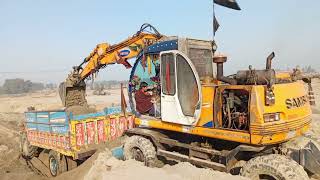 Samsung excavator heavy equipment loading on tractor🚜 trolley amazing||samsung excavator