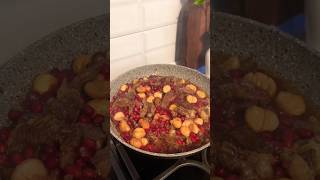 Stewed meat in pomegranate and chestnut sauce.