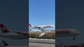 Swiss Boeing 777-300ER landing at LAX & Lufthansa 747-8 taking off