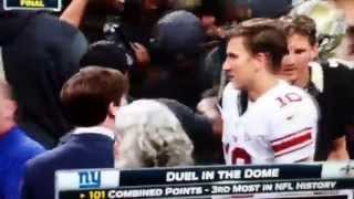 Eli Manning leaves Luke Mccown hanging.        (Funny)