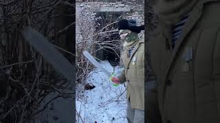 Russian mobilised soldier clears shrubs with a machete at training facilities in Vladimir Oblast