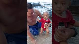 baby dinoy loves to swim in the beach