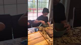 Kiddos making homemade bread with cinnamon swirl