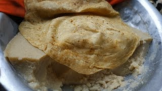 Shahi paratha and halwa street food, Hardworking Man Selling shahi paratha,He Manages Everything