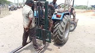 Tractor forklift testing with humans . to be used on street light maintenance work