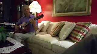 My Dad relaxing at home on his guitar