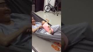 Baby sleeping on the hammock with ba ngoai (Mia was 1y old)