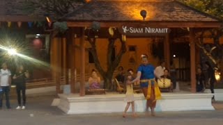 Young girl beautifully dances with actor from Siam niramit