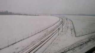 Paris Gare de Lyon to Montpellier TGV train journey. snow covered landscape of Paris outskirts