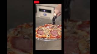 Person Slicing a Pizza#shorts