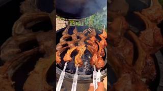 Cooking lamb ribs in a smoker.