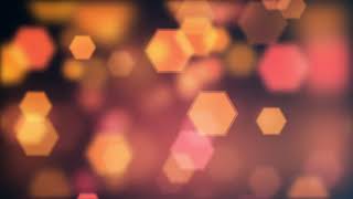 Orange, Pink, Yellow Geometric Bokeh Lights moving on Dark Background. Relaxing Screensaver.