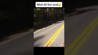 Skateboarding car down hill