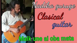 malak une ai oba mata/Nadika guruge/playing guitar