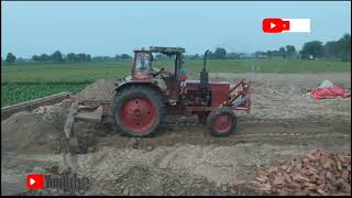 Belarus tractor 510/back blade dust in background/best performance