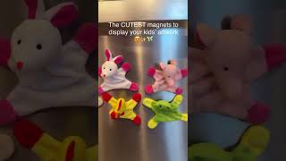 Mom hangs kids’ artwork with creative magnets