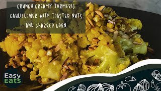 Crunchy creamy turmeric cauliflower with toasted nuts and charred corn