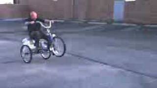 popping a wheelie on granmas three wheeler bicycle