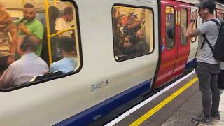 District Line train arriving at Tower Hill