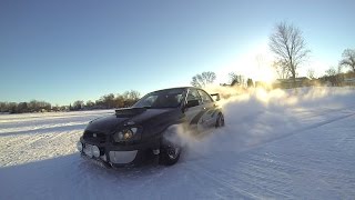 STI, Evo, BMW, & Impreza driving on snow.