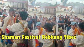 Shaman Festival in Rebkong Amdo Tibet. Face piercing rituals to honor mountain god.  青海热贡同仁脸颊穿刺祭祀山神