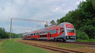 LTG Link EJ575-011 on route passing railway station