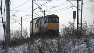 97301 & 31459 'Cerberus' pass Hensall in the snow on 8X03. (30.11.10) .