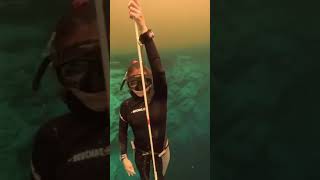 female free diver having fun underwater