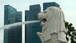 Singapore - bay shore in city center and the world famous Merlion gargoyle figure