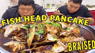 Fat brother made his own fish head pancake and his brother-in-law said it was delicious